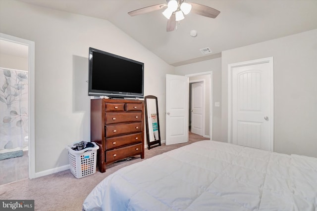 bedroom featuring carpet floors, baseboards, visible vents, and vaulted ceiling