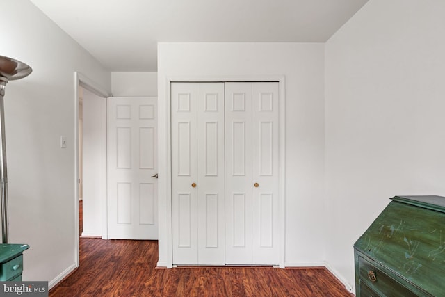 4504 Little River Run Dr, Annandale, VA 22003 - unfurnished bedroom with dark wood-style floors, a closet, and baseboards