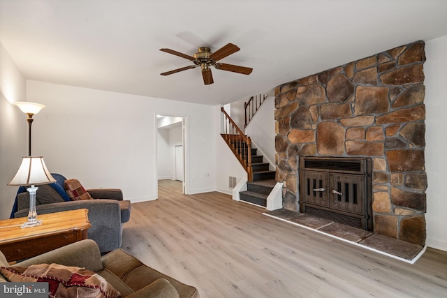 4504 Little River Run Dr, Annandale, VA 22003 - living area featuring wood finished floors, a ceiling fan, baseboards, stairs, and a fireplace