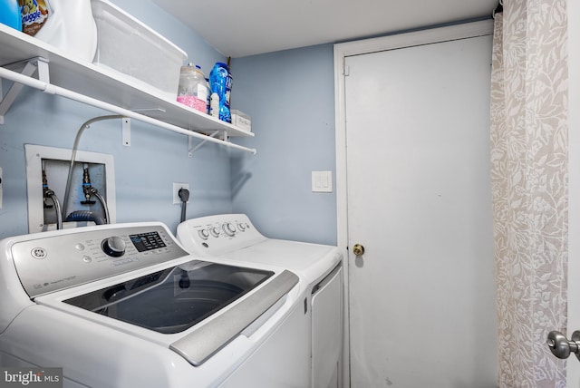 laundry room with washing machine and dryer and laundry area