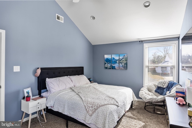 bedroom featuring visible vents, carpet floors, baseboards, and vaulted ceiling