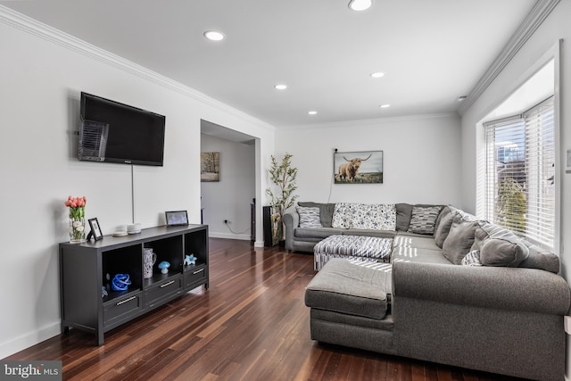 living area with dark wood-style floors, baseboards, and ornamental molding