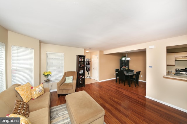 living room with wood finished floors and baseboards