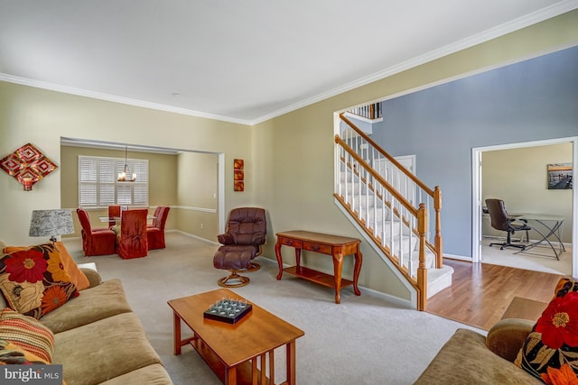 living area with a notable chandelier, stairway, baseboards, and ornamental molding