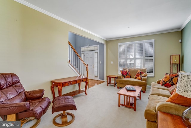 carpeted living area with stairway, baseboards, and crown molding