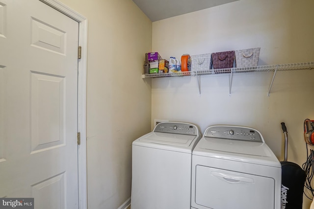 clothes washing area with laundry area and independent washer and dryer