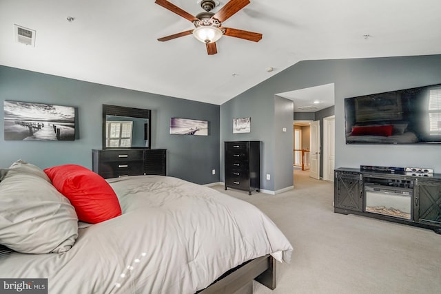 bedroom with visible vents, baseboards, carpet, vaulted ceiling, and a ceiling fan