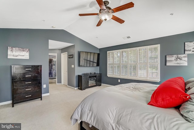 carpeted bedroom featuring a ceiling fan, lofted ceiling, visible vents, and baseboards