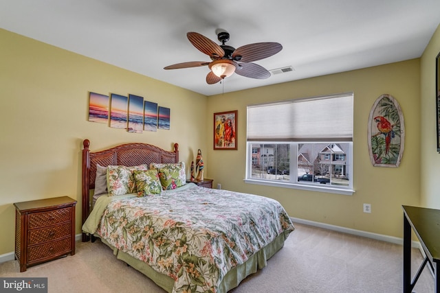 bedroom with baseboards, visible vents, carpet floors, and ceiling fan