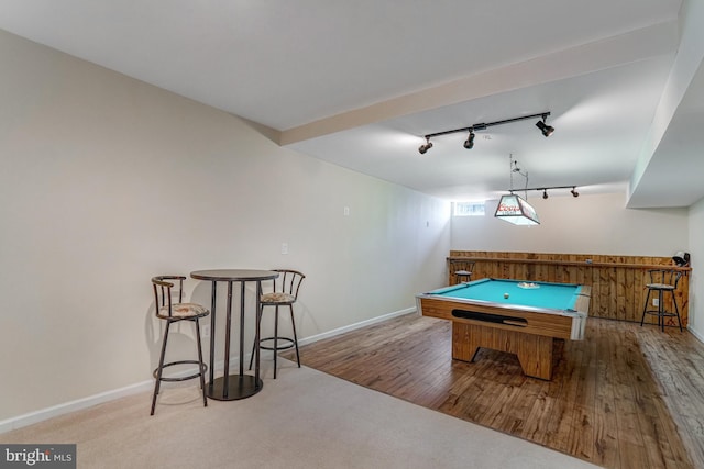 game room with baseboards, a bar, wood finished floors, and pool table