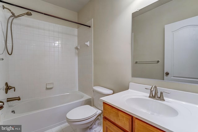 bathroom featuring shower / bathtub combination, toilet, vanity, and tile patterned flooring