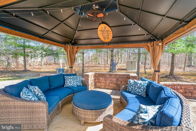 view of patio with a gazebo and an outdoor hangout area