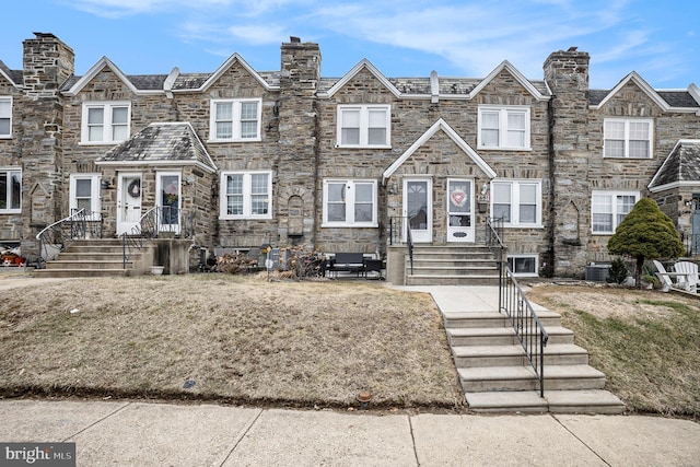 view of front facade featuring stone siding