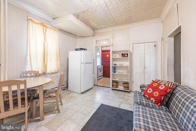 kitchen with ornamental molding, white appliances, and an ornate ceiling