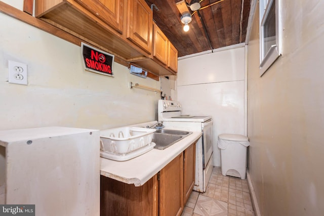 kitchen featuring brown cabinetry, wooden ceiling, and light countertops