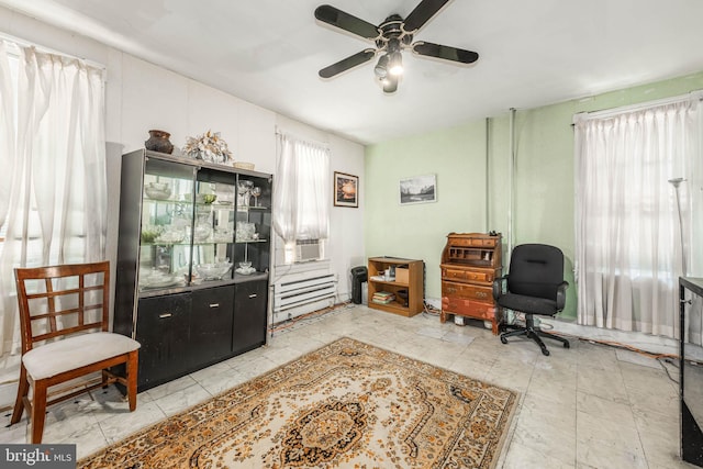 sitting room featuring a ceiling fan and cooling unit