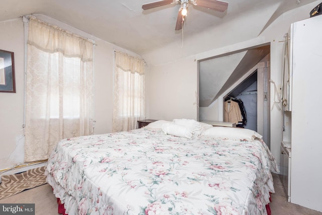 bedroom featuring a ceiling fan and lofted ceiling