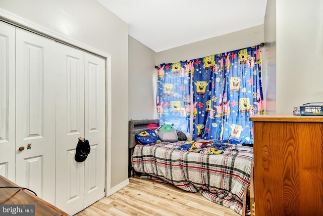 bedroom featuring a closet and wood finished floors