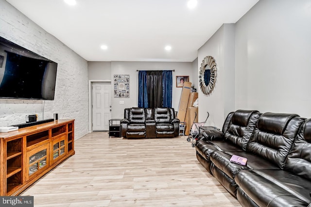 living area featuring recessed lighting and light wood-style flooring