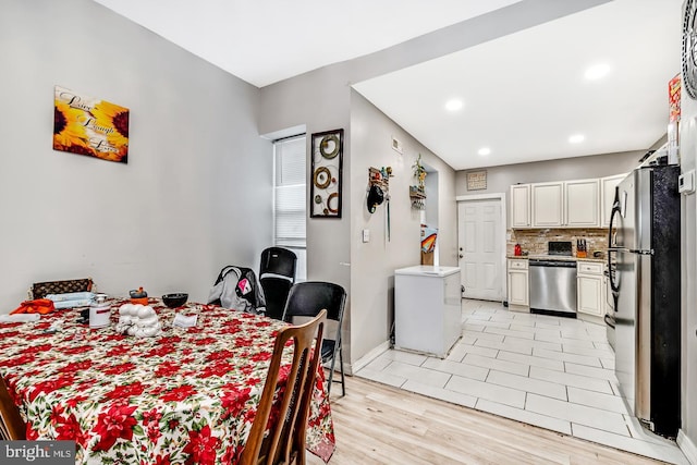 dining area featuring baseboards, light tile patterned flooring, and recessed lighting