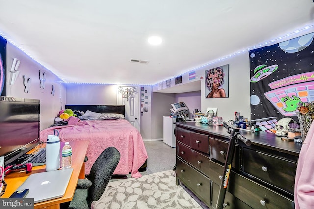 bedroom featuring baseboards and visible vents