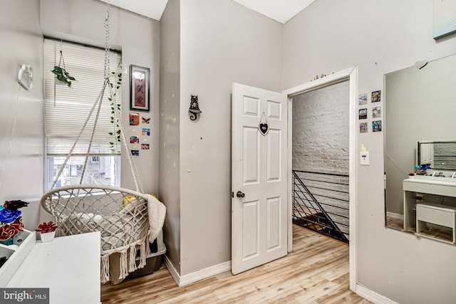 bedroom with wood finished floors and baseboards