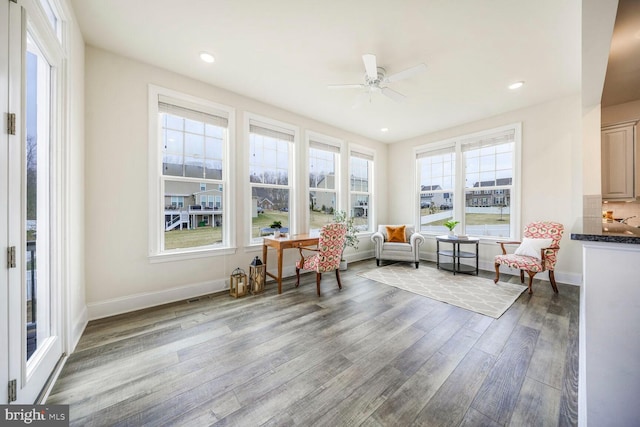 sunroom with ceiling fan