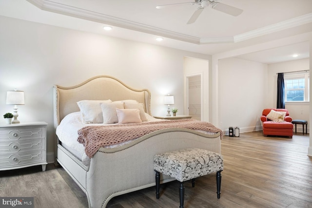 bedroom featuring recessed lighting, ornamental molding, a ceiling fan, wood finished floors, and baseboards