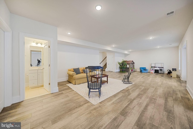 interior space with visible vents, stairway, wood finished floors, and recessed lighting