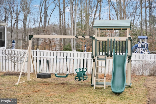 view of play area with a lawn and fence