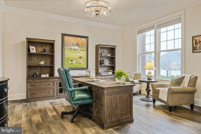 office area with hardwood / wood-style flooring, baseboards, a chandelier, and crown molding