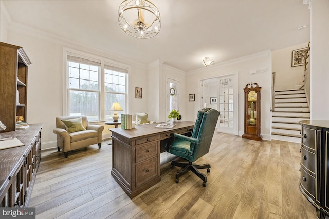 office featuring light wood-style floors, baseboards, ornamental molding, and an inviting chandelier