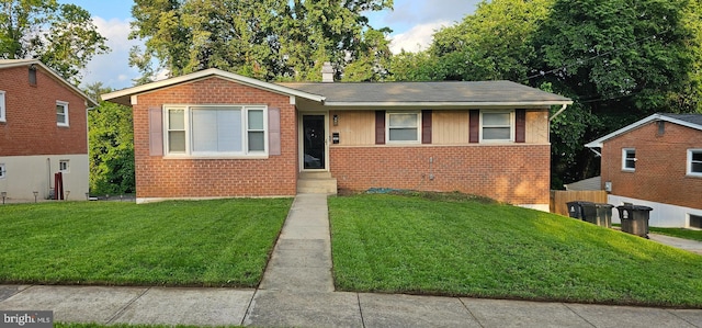 view of front of house with brick siding and a front yard