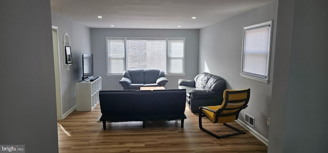 sitting room featuring recessed lighting, visible vents, baseboards, and wood finished floors