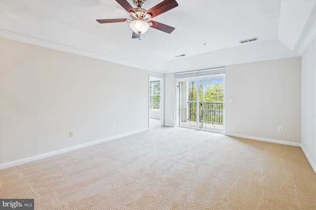 empty room featuring visible vents, ceiling fan, baseboards, and light colored carpet