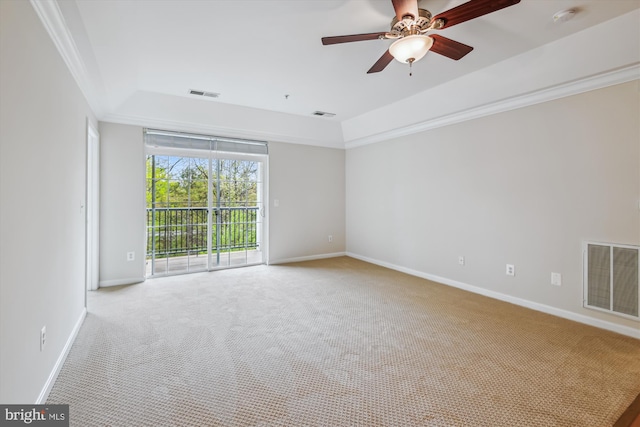 empty room featuring light colored carpet, baseboards, a ceiling fan, and visible vents
