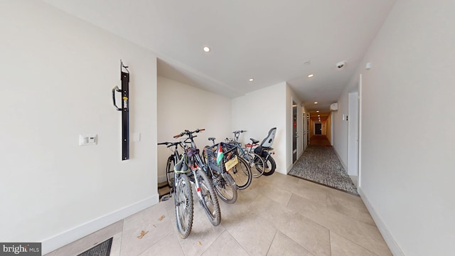 interior space with recessed lighting and baseboards