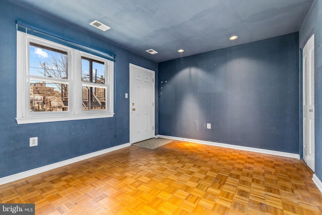 foyer entrance featuring recessed lighting, baseboards, and visible vents