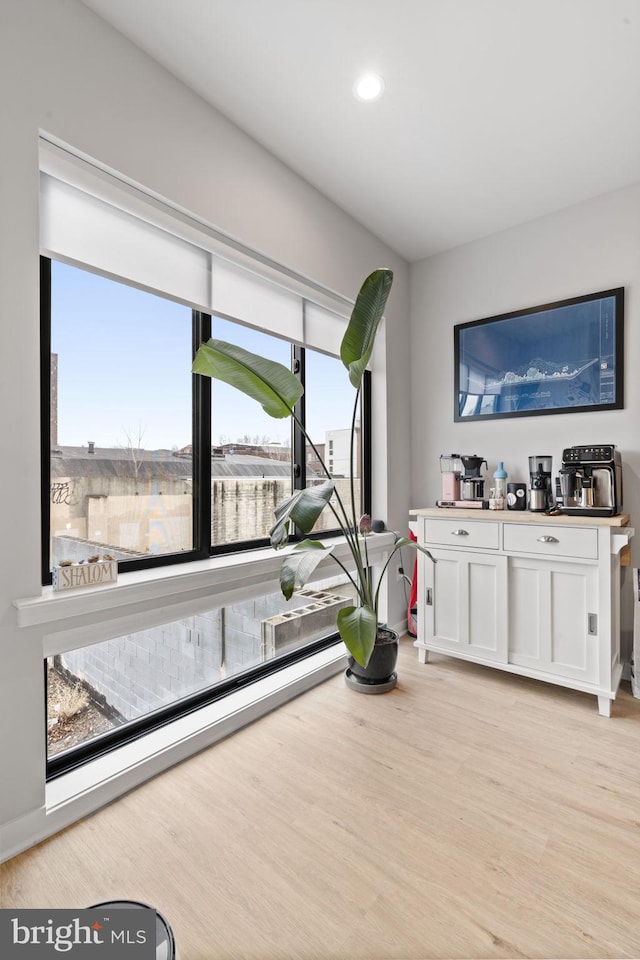 interior space with recessed lighting, baseboard heating, and light wood-style flooring