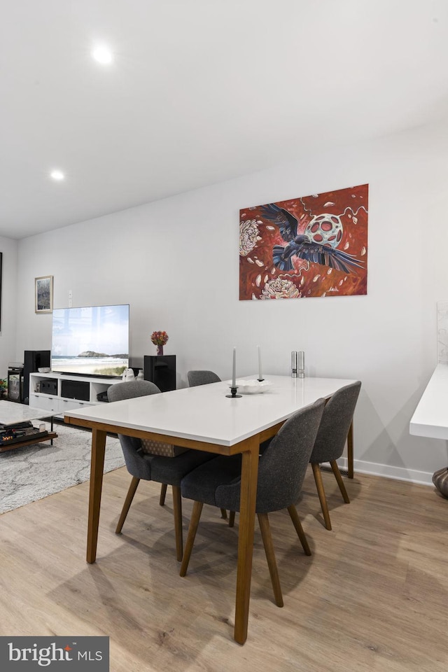 dining room featuring recessed lighting, wood finished floors, and baseboards