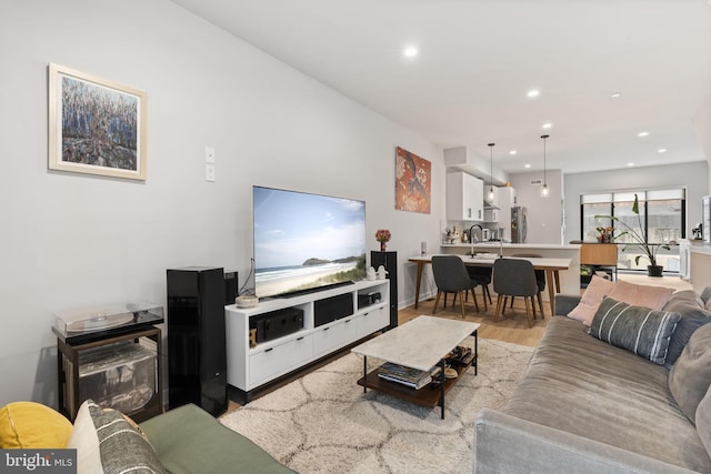 living room featuring recessed lighting and wood finished floors