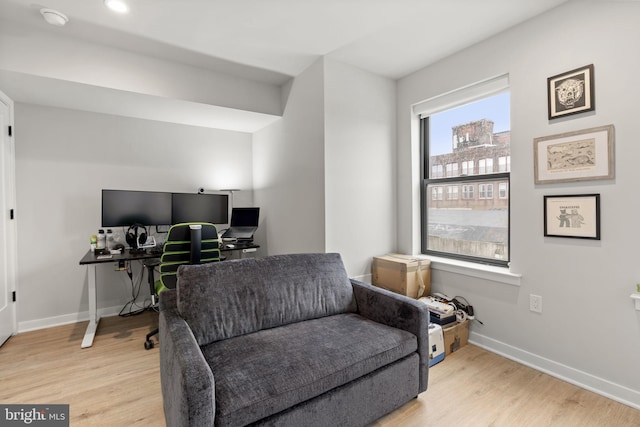 office with light wood-style floors and baseboards