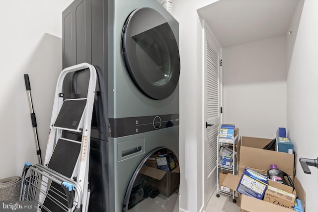 laundry area featuring laundry area and stacked washer and clothes dryer