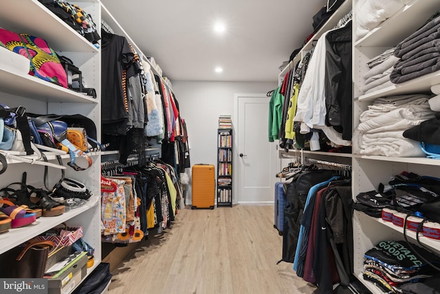 spacious closet featuring wood finished floors