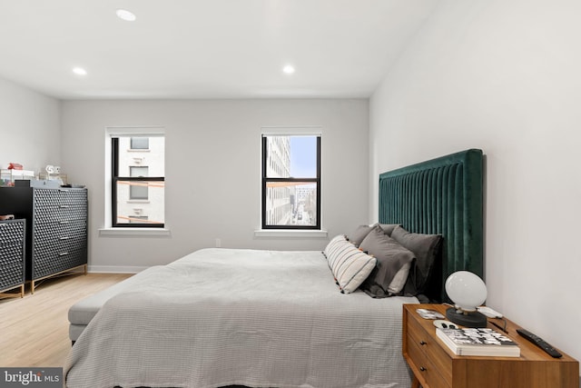 bedroom featuring recessed lighting, baseboards, and wood finished floors