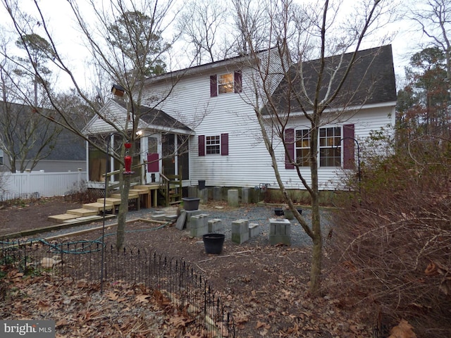 view of front of house featuring fence