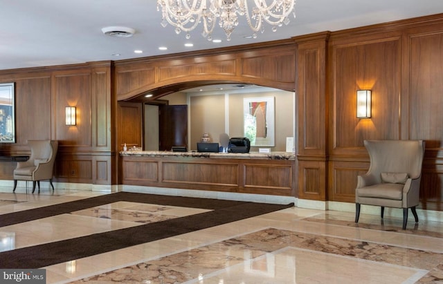 welcome area with visible vents and an inviting chandelier