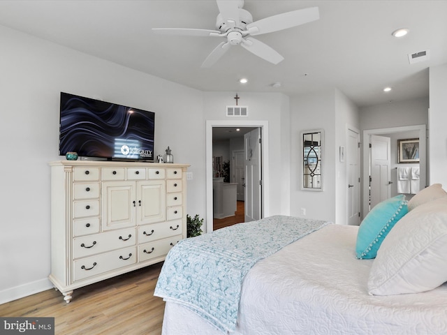 bedroom featuring light wood-style flooring, visible vents, baseboards, and recessed lighting