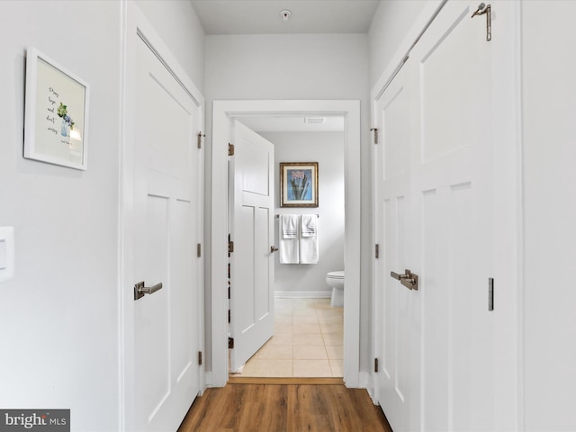 corridor with wood finished floors