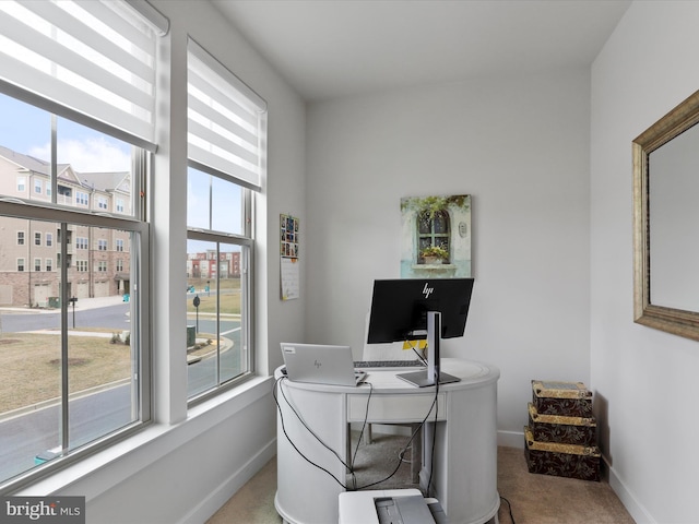 carpeted office with baseboards